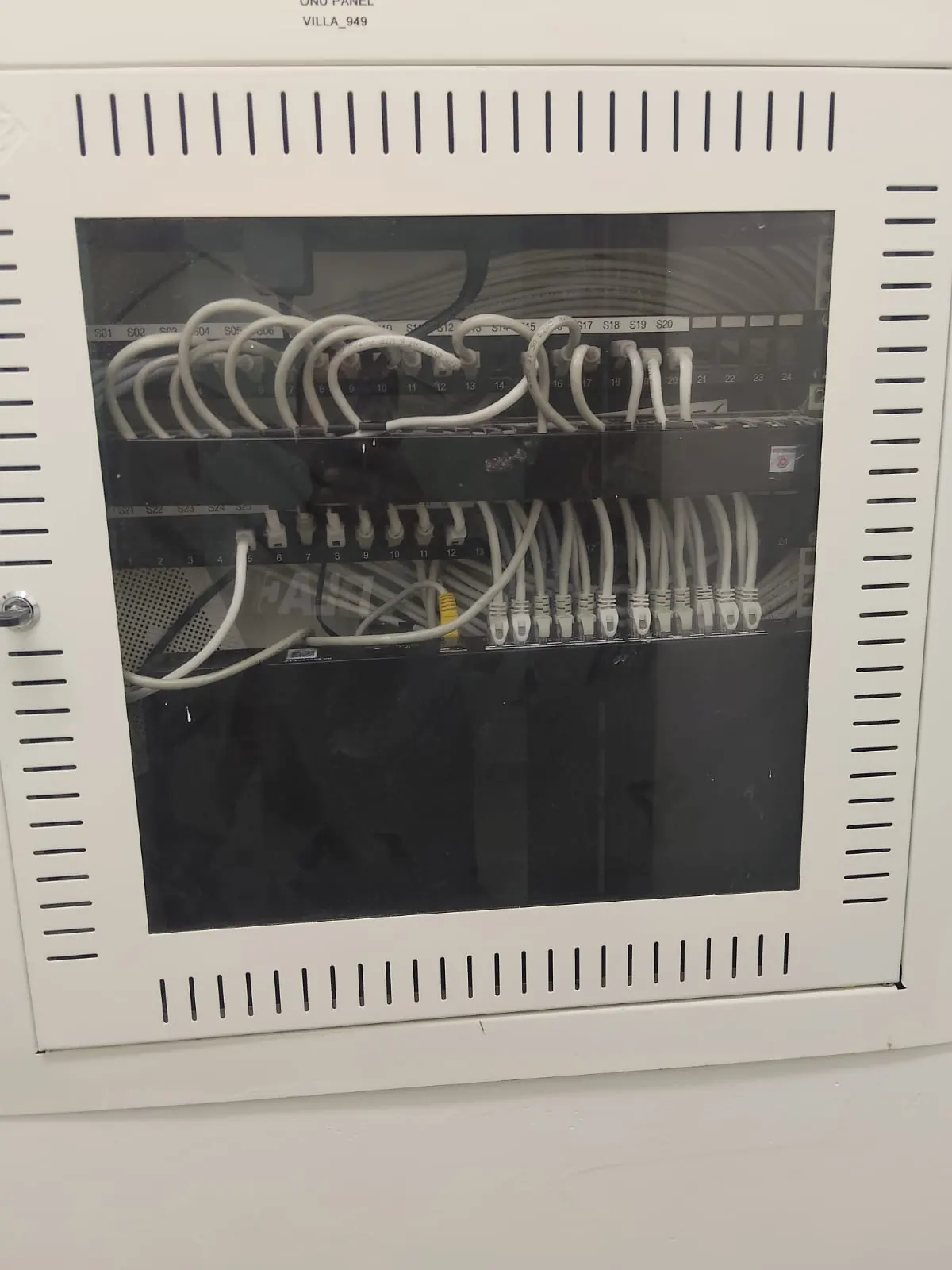 Network cabinet with labeled patch panel and Ethernet connections